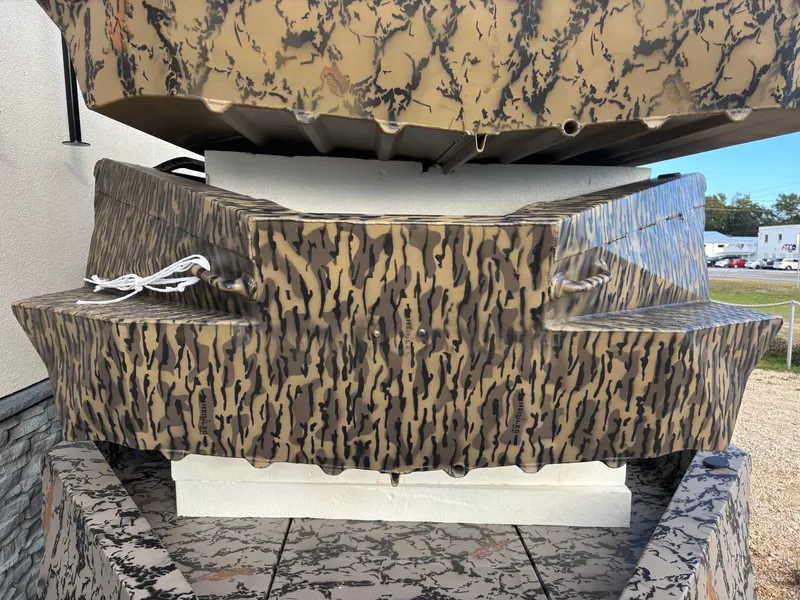 Slide: The Image of 2025 Edge Duck Boats 553 DB with camouflage design, displayed outdoors. - 3