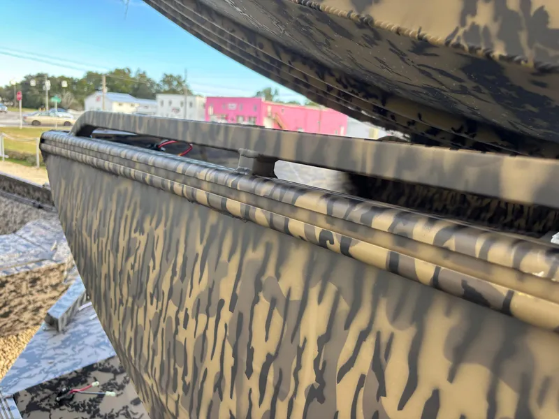 Slide: The Image of 2025 Edge Duck Boats 553 DB with camouflage pattern, close-up view. - 8