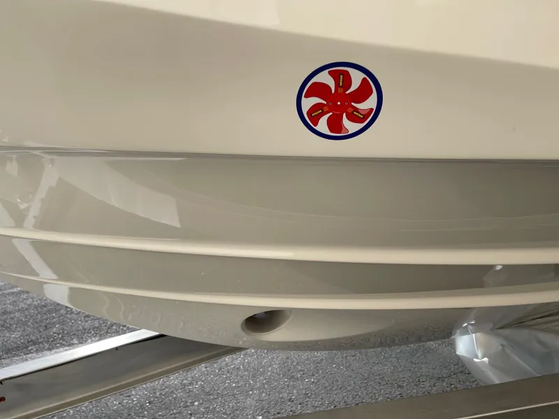 Slide: The Image of Bayliner Trophy T29 Explorer 2025 boat hull with red and blue emblem. - 17