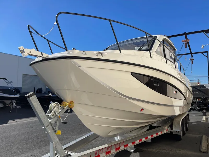 Slide: The Image of 2025 Bayliner Trophy T29 Explorer boat on trailer, outdoor display. - 2