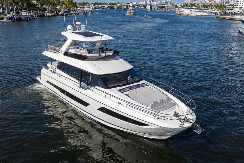 Slide: The Image of Luxury 2021 Prestige 690 yacht cruising on a sunny day. - 0