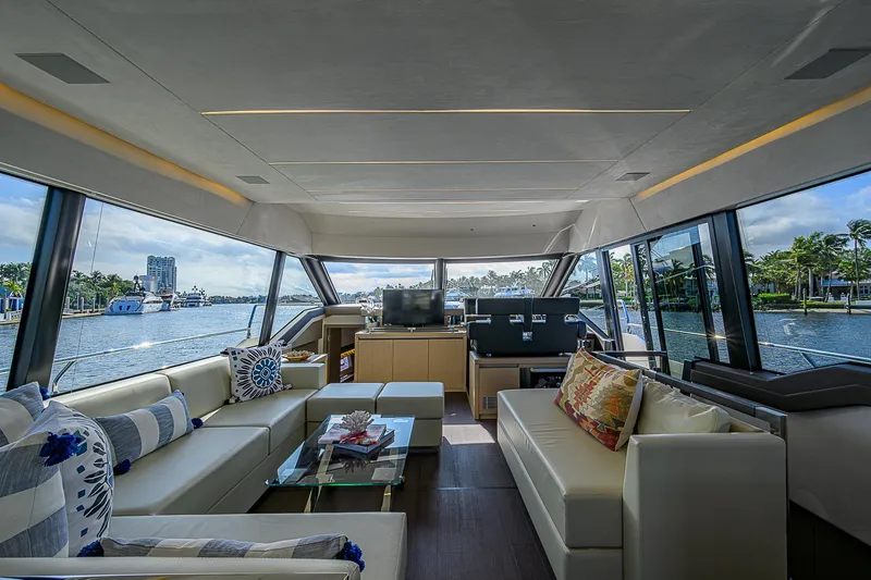 Slide: The Image of Luxurious interior of 2021 Prestige 690 yacht with panoramic windows and elegant seating. - 1