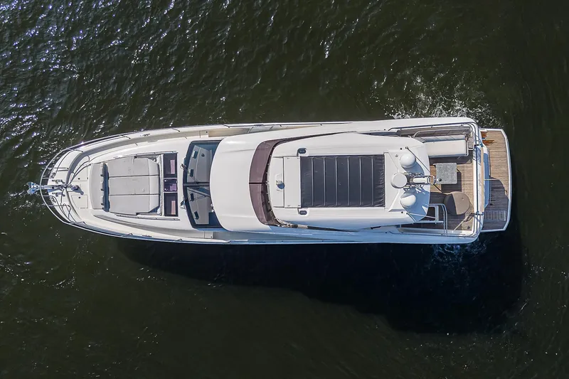 Slide: The Image of Aerial view of 2021 Prestige 690 yacht cruising on water. - 10