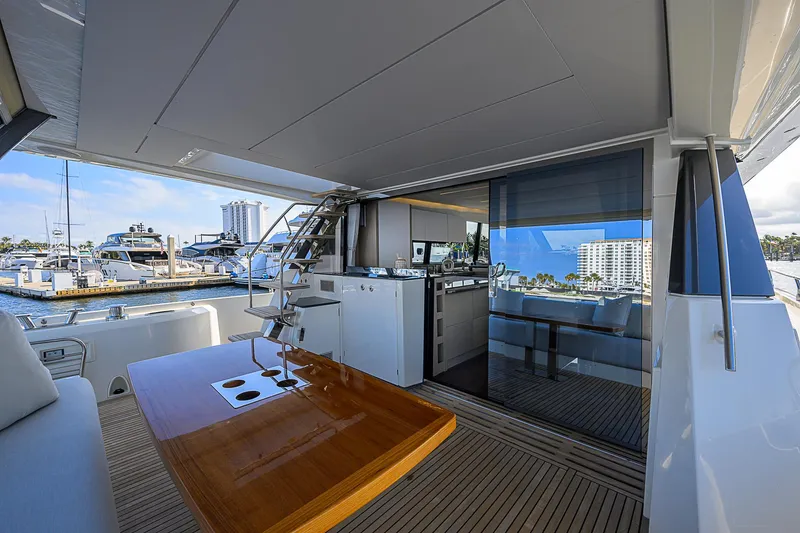 Slide: The Image of Luxurious 2021 Prestige 690 yacht interior with modern design and marina view. - 19
