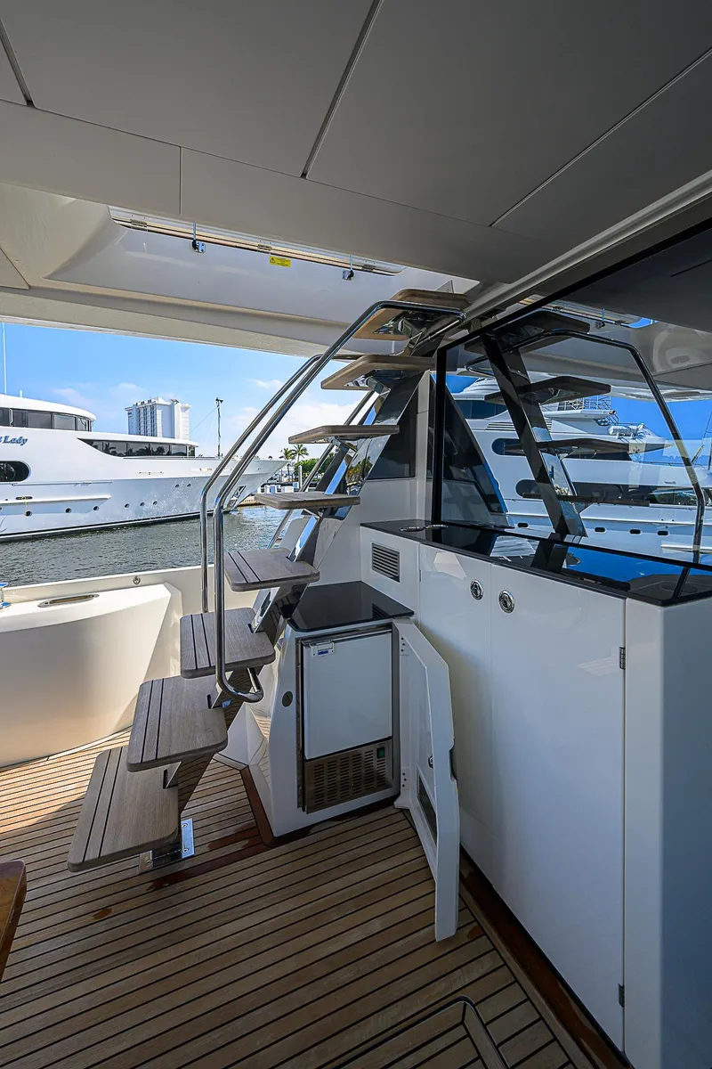 Slide: The Image of Prestige 690 yacht interior, 2021 model, featuring sleek design and modern amenities. - 26