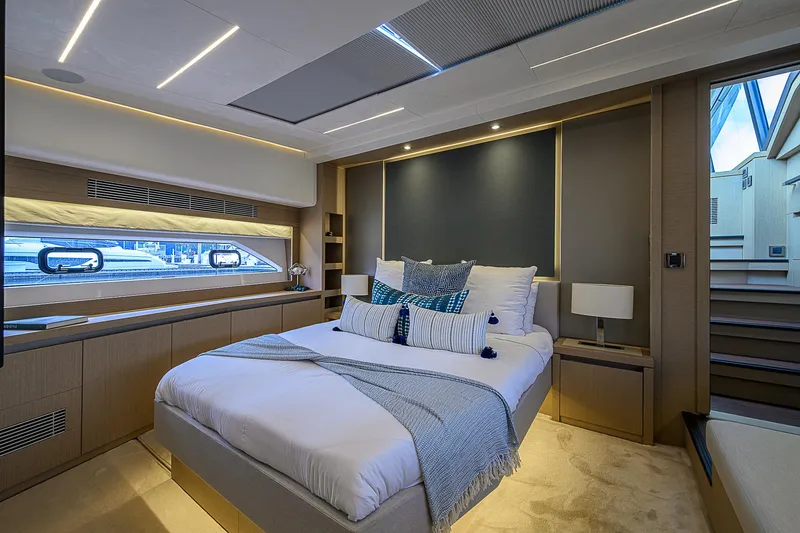 Slide: The Image of Luxurious bedroom interior of 2021 Prestige 690 yacht with modern design and elegant decor. - 3