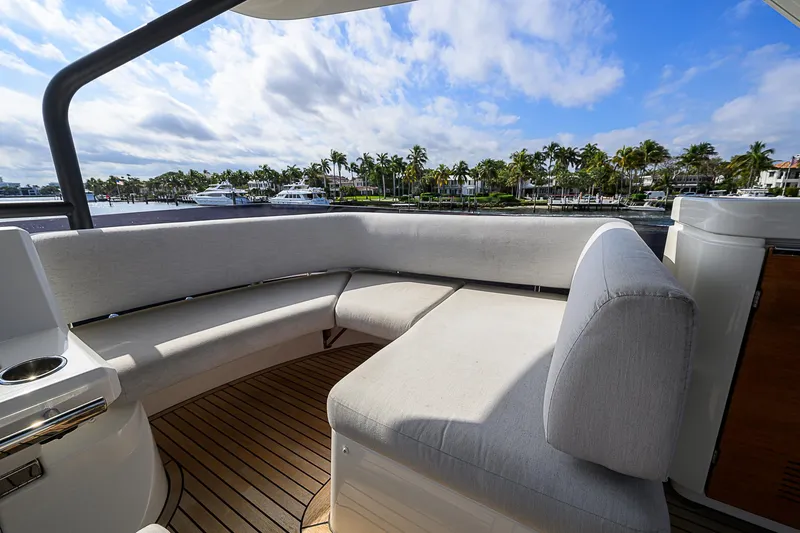 Slide: The Image of Luxurious seating area on 2021 Prestige 690 yacht with scenic waterfront view. - 36