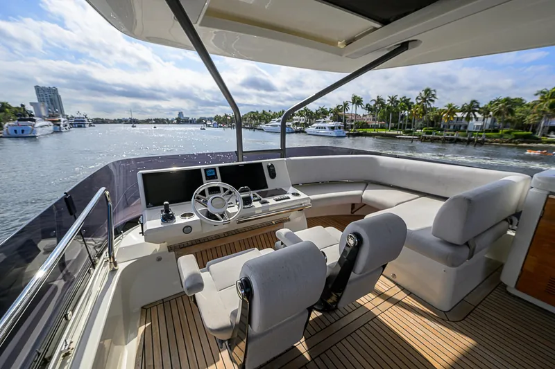 Slide: The Image of Luxurious 2021 Prestige 690 yacht interior with modern helm and spacious seating. - 37