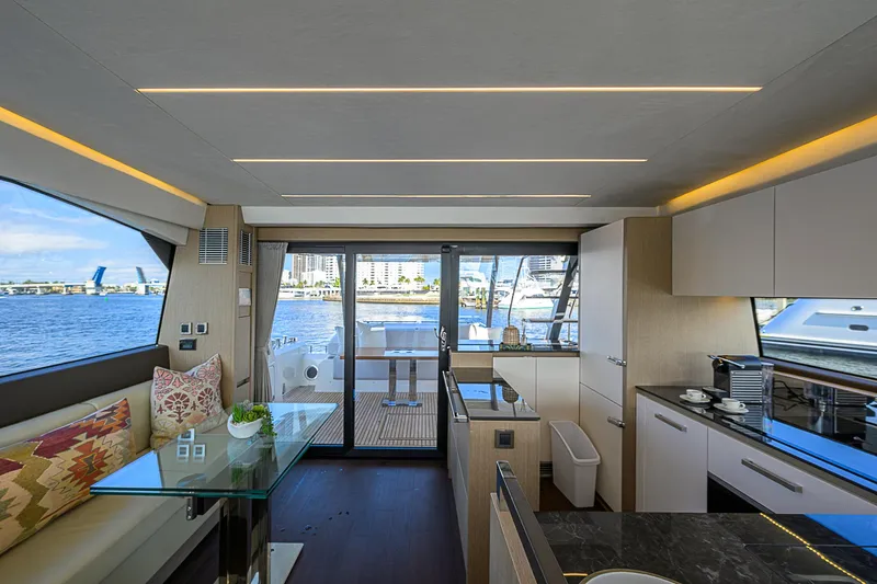 Slide: The Image of Luxurious interior of 2021 Prestige 690 yacht with modern kitchen and waterfront view. - 42