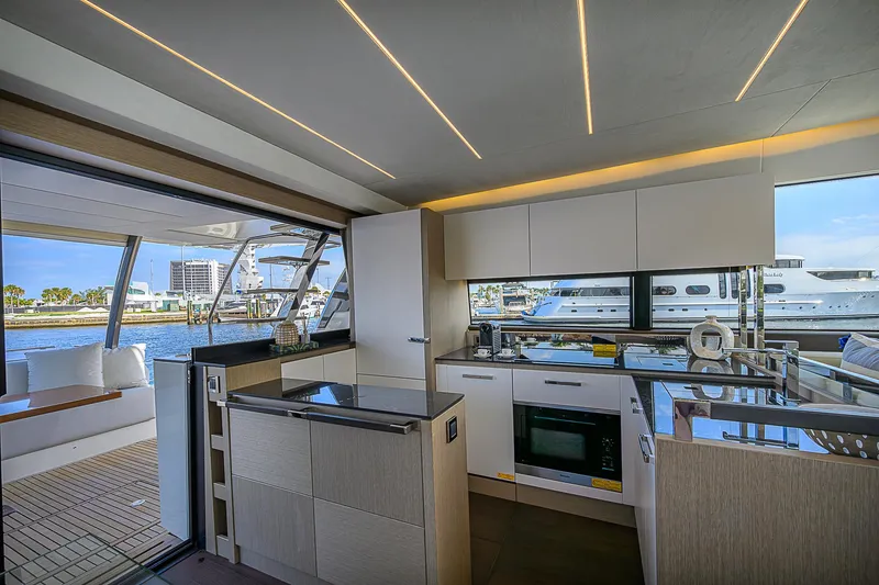 Slide: The Image of Luxurious 2021 Prestige 690 yacht kitchen with modern design and waterfront view. - 43