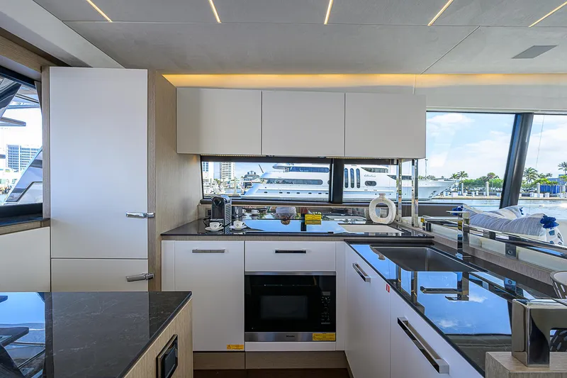 Slide: The Image of Modern kitchen interior on 2021 Prestige 690 yacht with sleek design and waterfront view. - 44