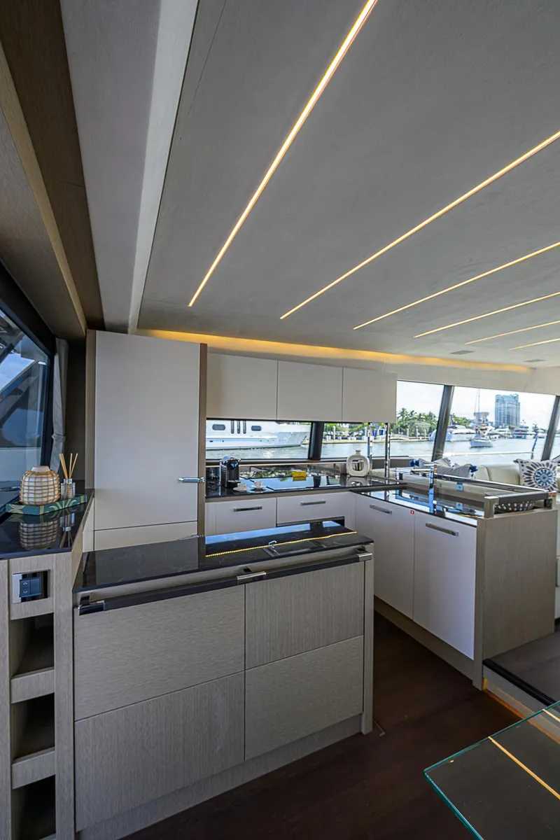 Slide: The Image of Luxurious kitchen interior on a 2021 Prestige 690 yacht with modern design and sleek finishes. - 45