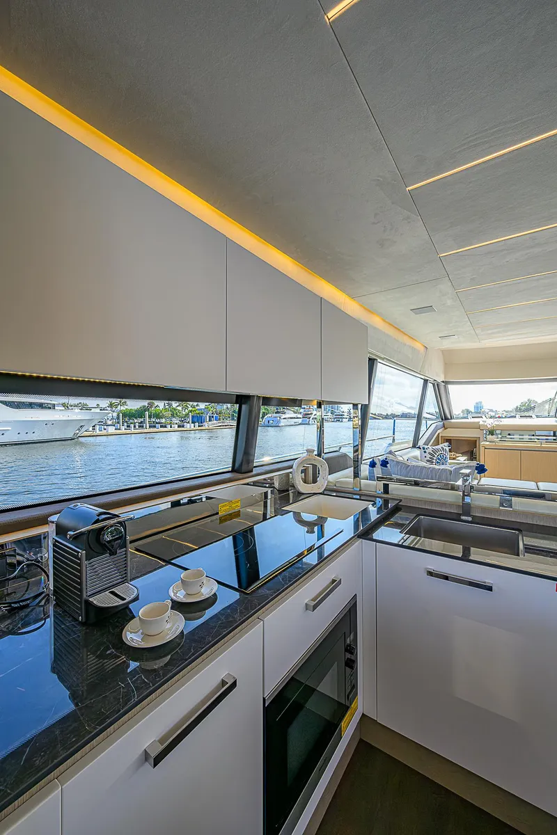 Slide: The Image of Modern kitchen interior on 2021 Prestige 690 yacht with sleek design and waterfront view. - 46