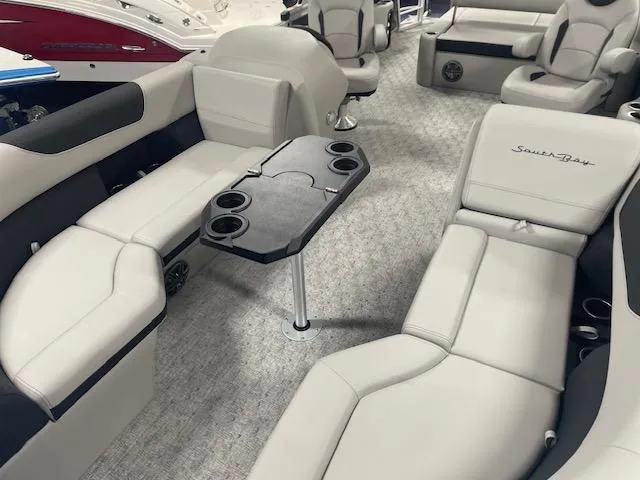 Slide: The Image of Luxurious 2025 South Bay 200 boat interior with plush seating and cup holders. - 12