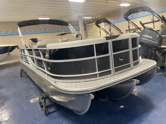 The Image of 2025 South Bay 200 pontoon boat in showroom, featuring sleek design and modern amenities. - 2