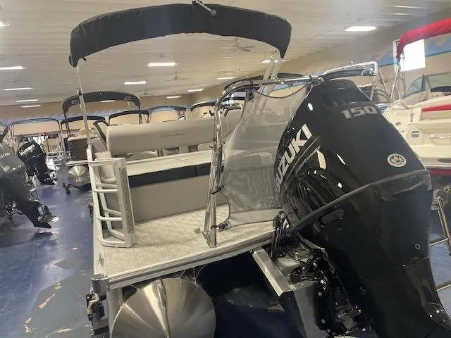 Slide: The Image of 2025 South Bay 200 pontoon boat with Suzuki 150 engine in showroom. - 4