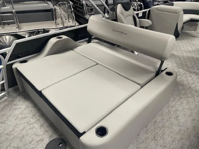 Slide: The Image of 2025 South Bay 200 boat with luxurious beige seating and cup holders. - 6