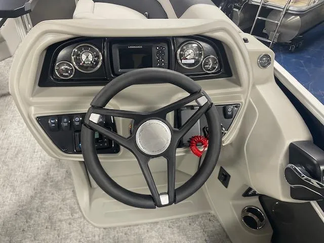 Slide: The Image of Steering console of 2025 South Bay 200 boat with modern controls and gauges. - 8