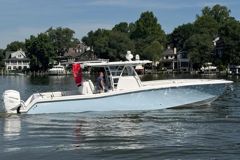 The Image of 2022 Invincible 39 Open Fisherman on calm water near houses. - 0