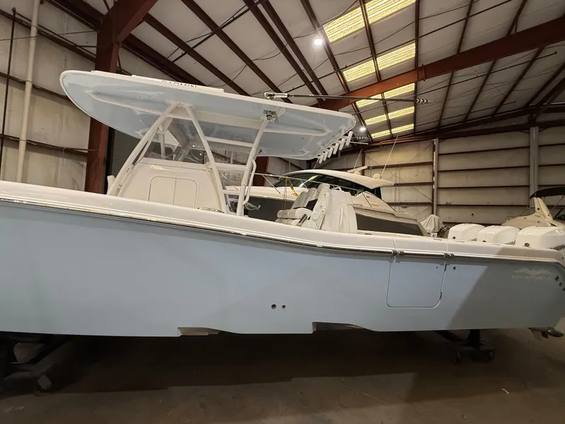 Slide: The Image of 2022 Invincible 39 Open Fisherman boat in a warehouse setting. - 12