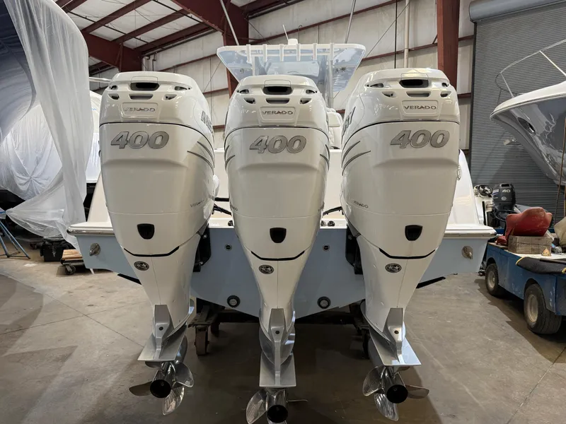 Slide: The Image of 2022 Invincible 39 Open Fisherman with triple 400 horsepower engines in a boatyard. - 13
