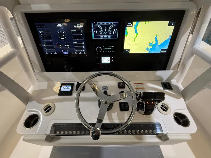 Slide: The Image of Invincible 39 Open Fisherman 2022 dashboard with navigation screens and controls. - 15