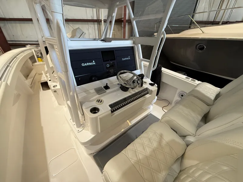 Slide: The Image of 2022 Invincible 39 Open Fisherman boat cockpit with Garmin navigation system. - 16