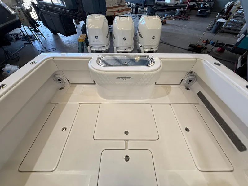 Slide: The Image of 2022 Invincible 39 Open Fisherman boat deck with triple outboard engines. - 18