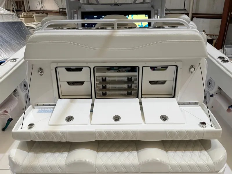 Slide: The Image of 2022 Invincible 39 Open Fisherman boat with white storage compartments and seating. - 23