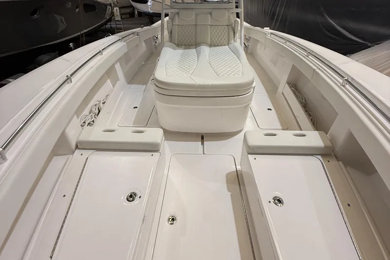 Slide: The Image of 2022 Invincible 39 Open Fisherman boat interior with white seating and spacious deck. - 24