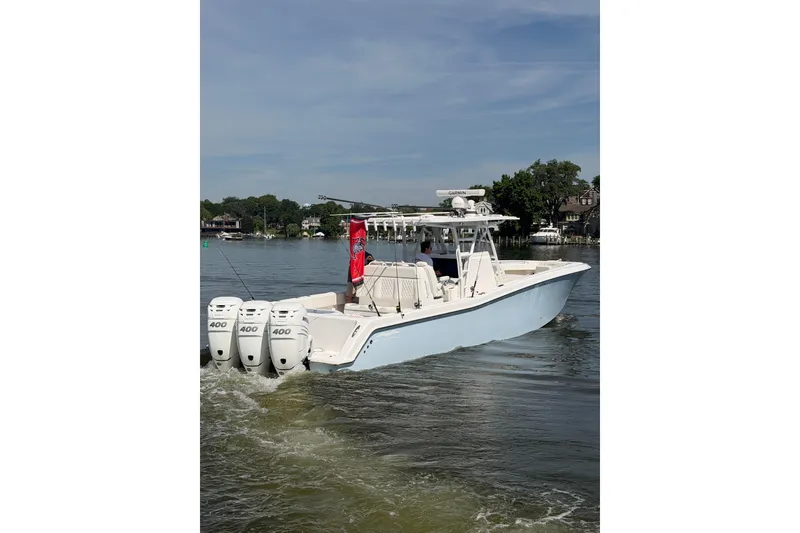 Slide: The Image of 2022 Invincible 39 Open Fisherman boat cruising on a calm lake. - 25