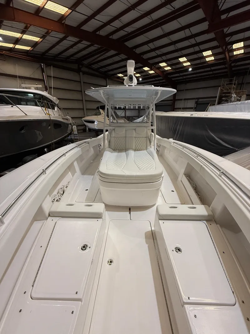 Slide: The Image of 2022 Invincible 39 Open Fisherman boat in a warehouse setting. - 26