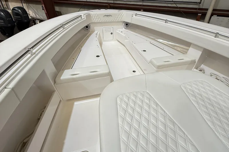 Slide: The Image of 2022 Invincible 39 Open Fisherman boat interior with white cushioned seating. - 27