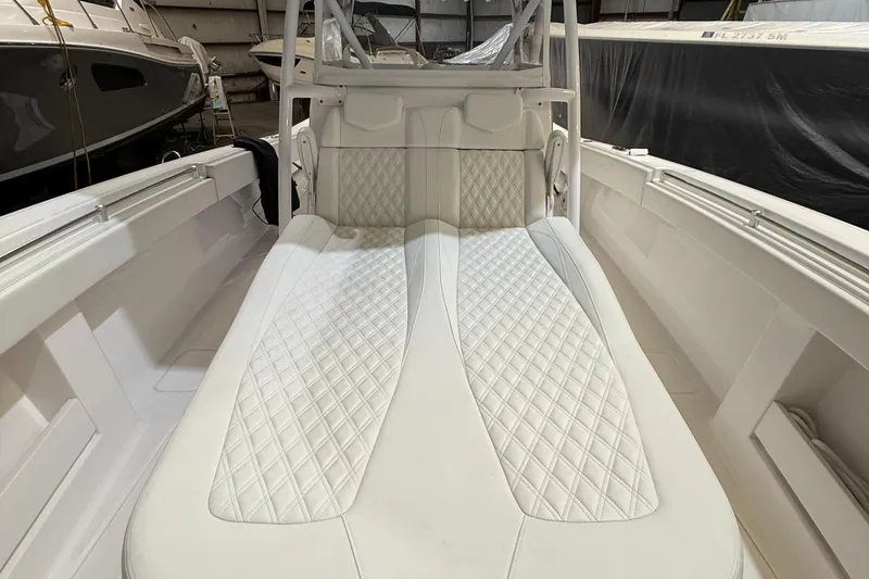 Slide: The Image of Invincible 39 Open Fisherman 2022 boat interior with white quilted seating. - 28