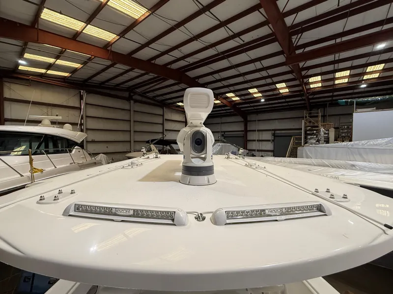 Slide: The Image of 2022 Invincible 39 Open Fisherman boat in a warehouse, showcasing deck and equipment. - 34