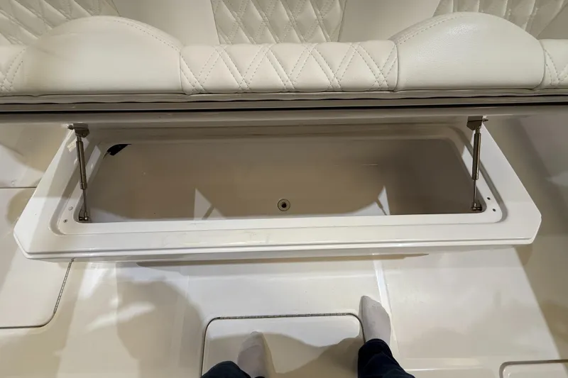 Slide: The Image of Open storage compartment on 2022 Invincible 39 Open Fisherman boat with cushioned seating. - 44