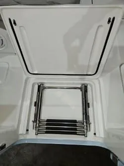 Slide: The Image of 2022 Invincible 39 Open Fisherman boat ladder compartment, open hatch view. - 46