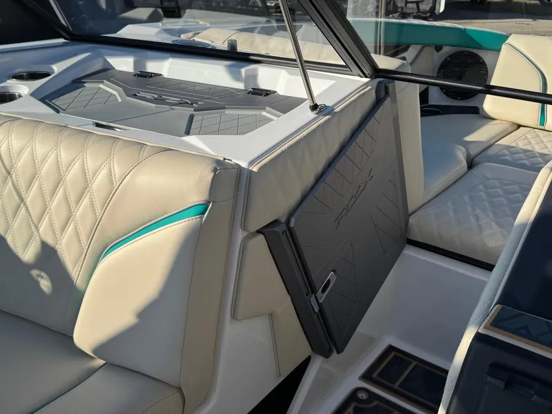 Slide: The Image of 2025 Tigé 22RZX boat interior with quilted seats and modern dashboard. - 7