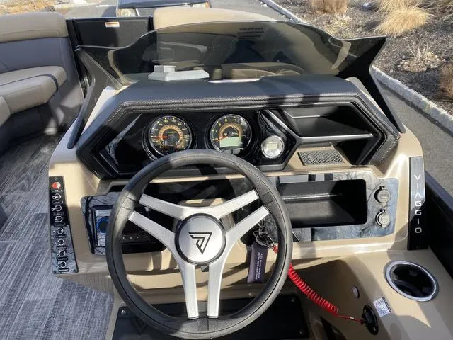 Slide: The Image of Viaggio x20u 2025 boat dashboard with steering wheel and instrument panel. - 12