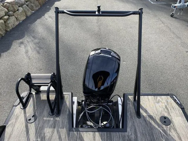 Slide: The Image of Viaggio x20u 2025 boat with Mercury outboard motor on a wooden deck. - 16