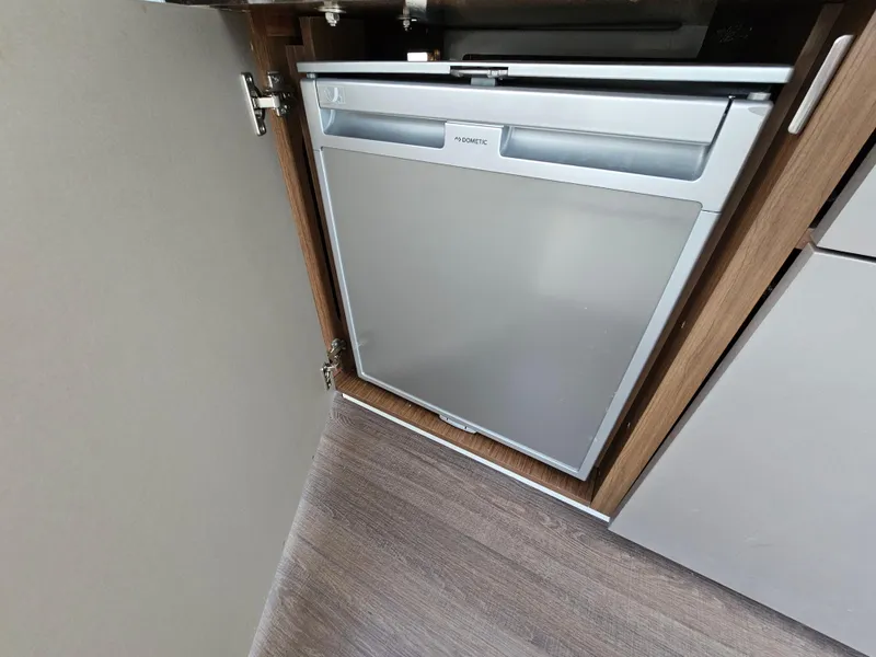 Slide: The Image of Built-in refrigerator in 2020 Beneteau Antares 9 boat interior. - 11