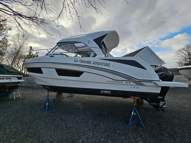 Slide: The Image of 2020 Beneteau Antares 9 boat on stands, outdoor setting, cloudy sky. - 2