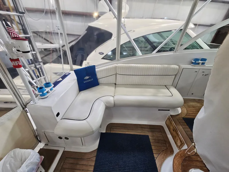 Slide: The Image of Luxurious seating area on a 2001 Davis 45 Express yacht with wooden flooring. - 12