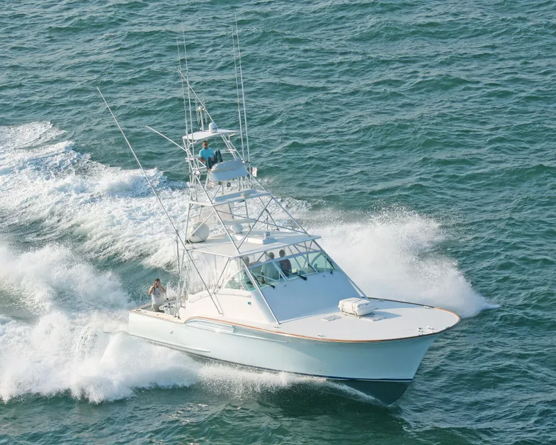 Slide: The Image of 2001 Davis 45 Express yacht cruising on open water. - 2