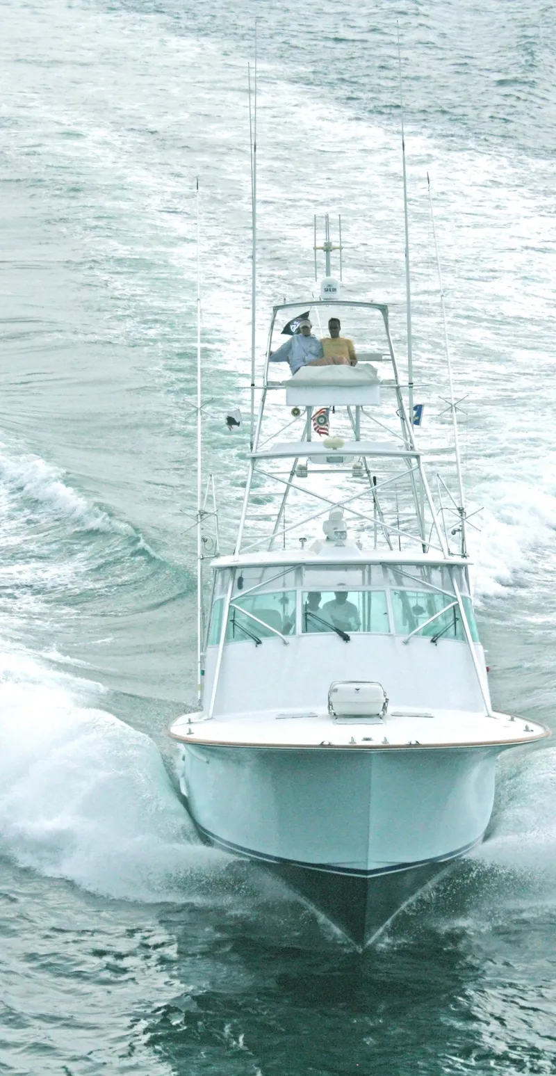 Slide: The Image of 2001 Davis 45 Express boat cruising on open water, viewed from the front. - 21