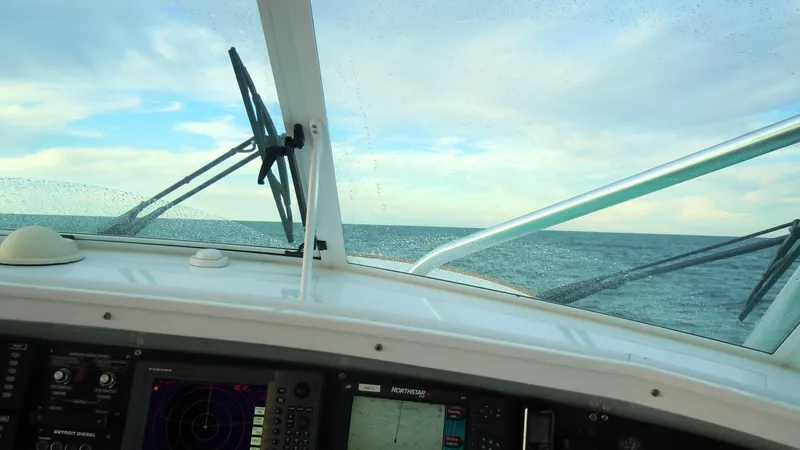 Slide: The Image of View from Davis 45 Express 2001 boat cockpit, showing ocean horizon and navigation instruments. - 7