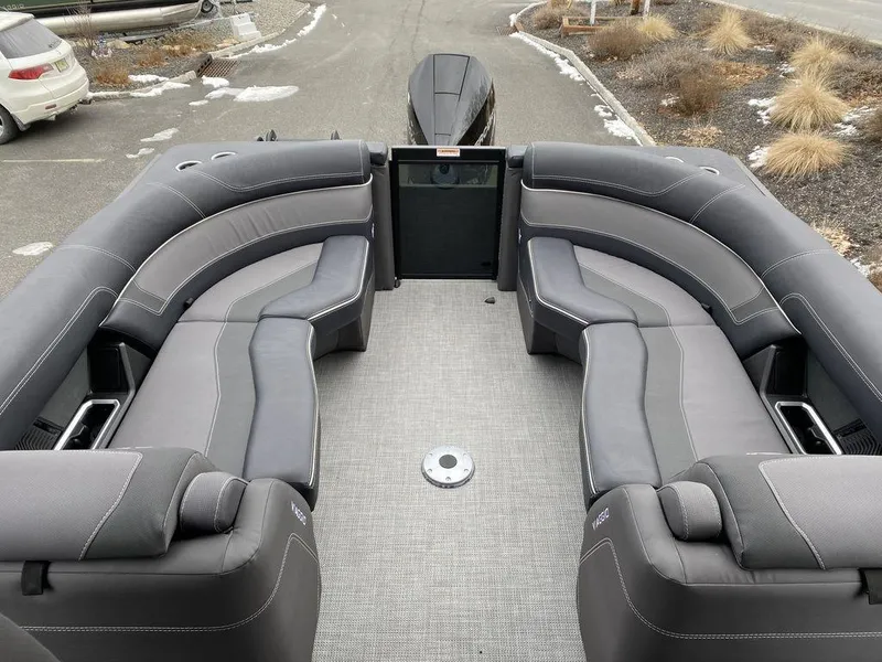 Slide: The Image of Viaggio D24U 2025 boat interior with gray seating and spacious layout. - 11