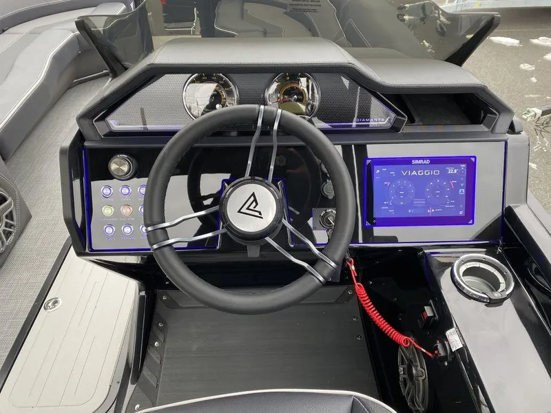 Slide: The Image of Viaggio D24U 2025 boat dashboard with steering wheel and digital display. - 16