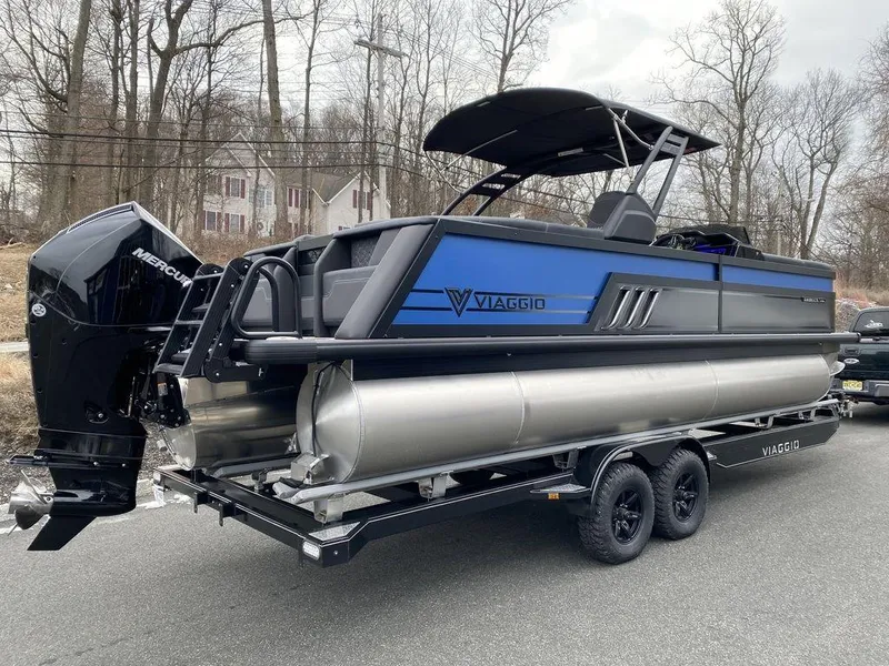 Slide: The Image of 2025 Viaggio D24U pontoon boat on trailer, featuring sleek design and powerful Mercury outboard motor. - 3
