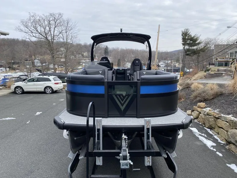 Slide: The Image of 2025 Viaggio D24U pontoon boat on trailer, parked outdoors. - 5